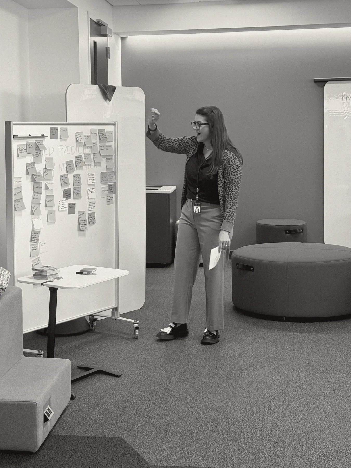 Stacey Layne Martin facilitating a working session at a sticky-note wall